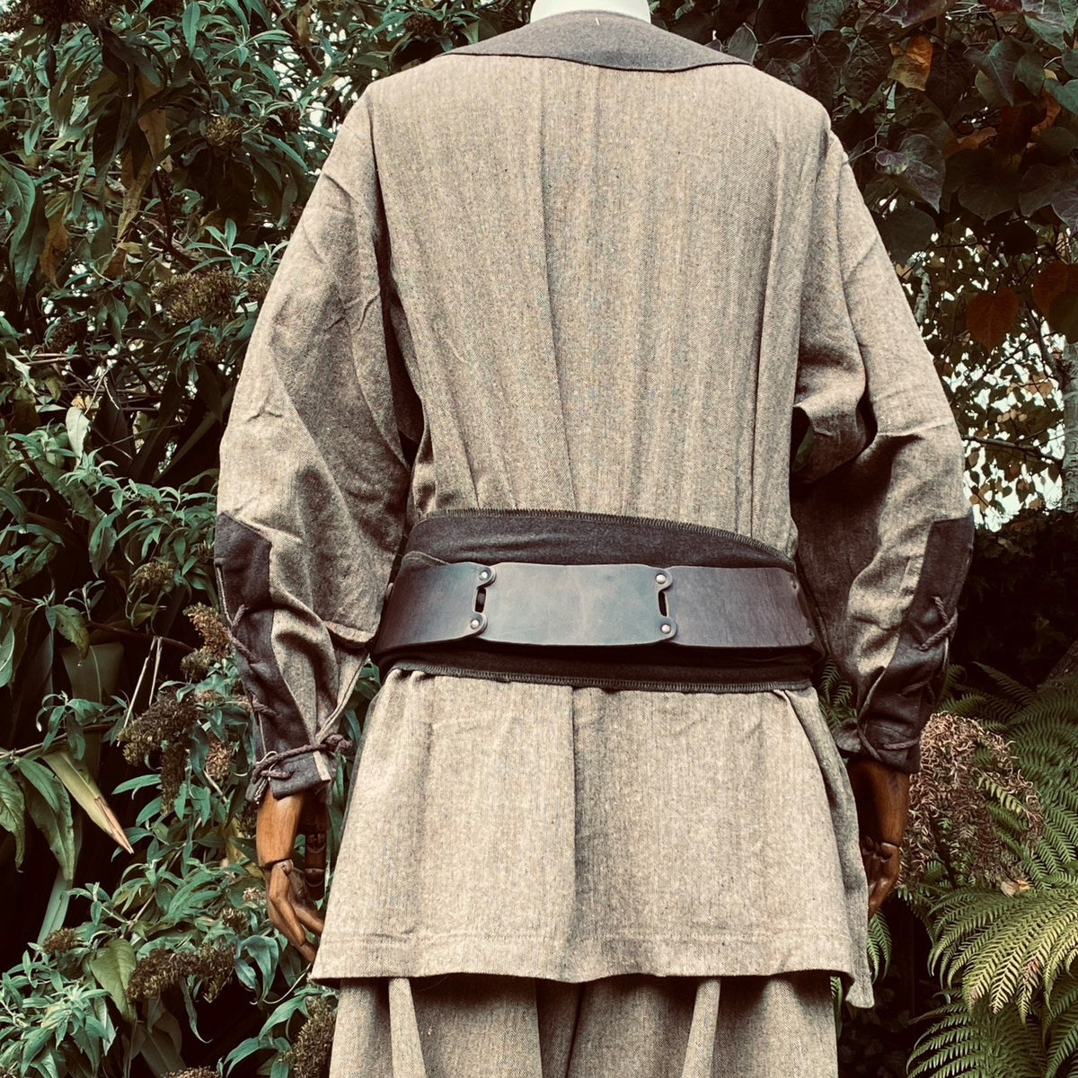 Back view of two-tone Viking shirt with dark elbow patches, for LARP events.