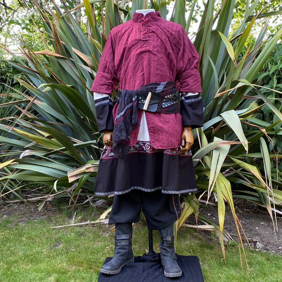 This Thin LARP Gambeson comes in Red Cotton. This Padded Tunic can sit on top of the rest of your kit. This Lightweight Gambeson is water resistant and keeps you warm. This Viking Tunic is perfect for your LARP Costume and LARP Character, Cosplay Events, and Ren Faires.