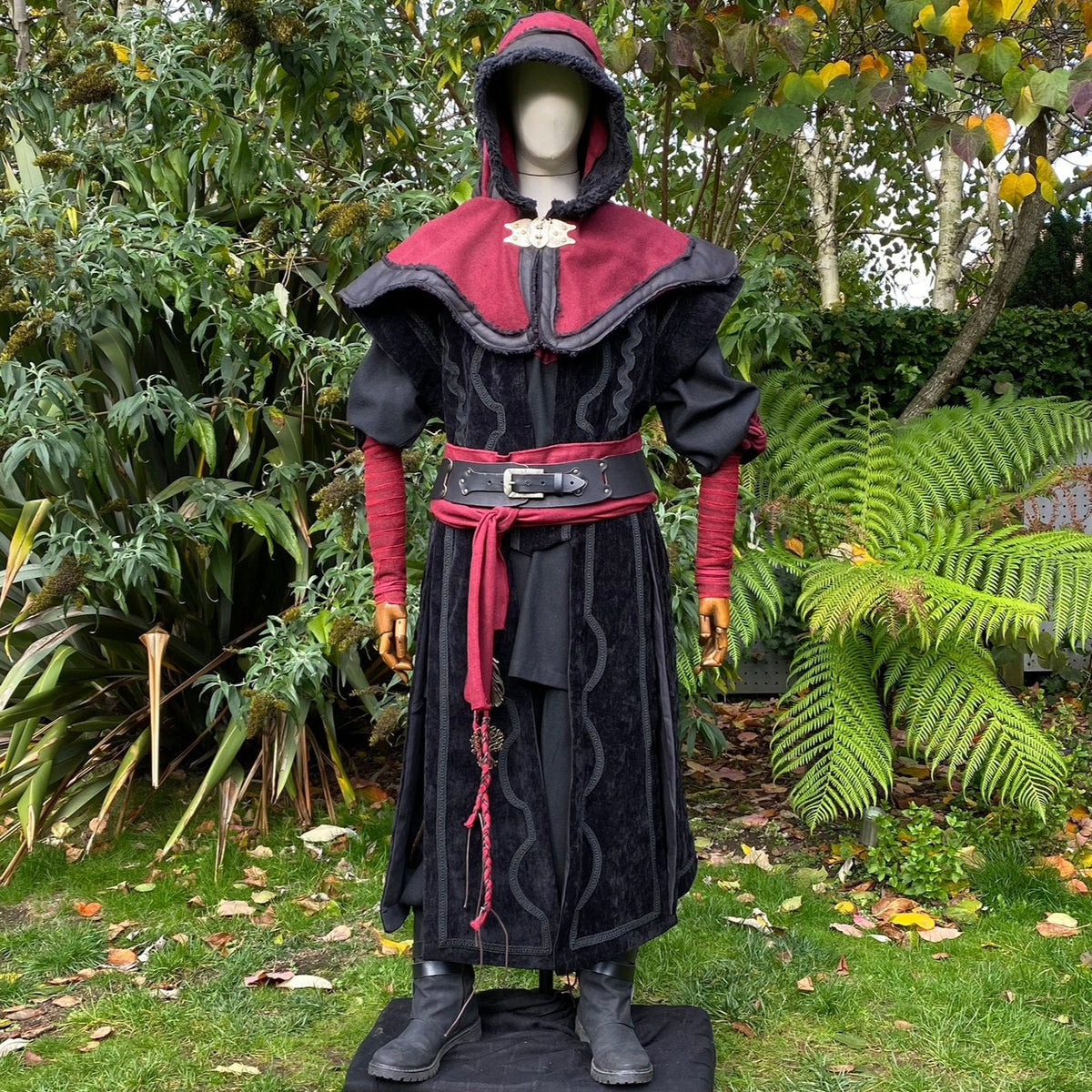Medieval LARP outfit with red hood and sash.