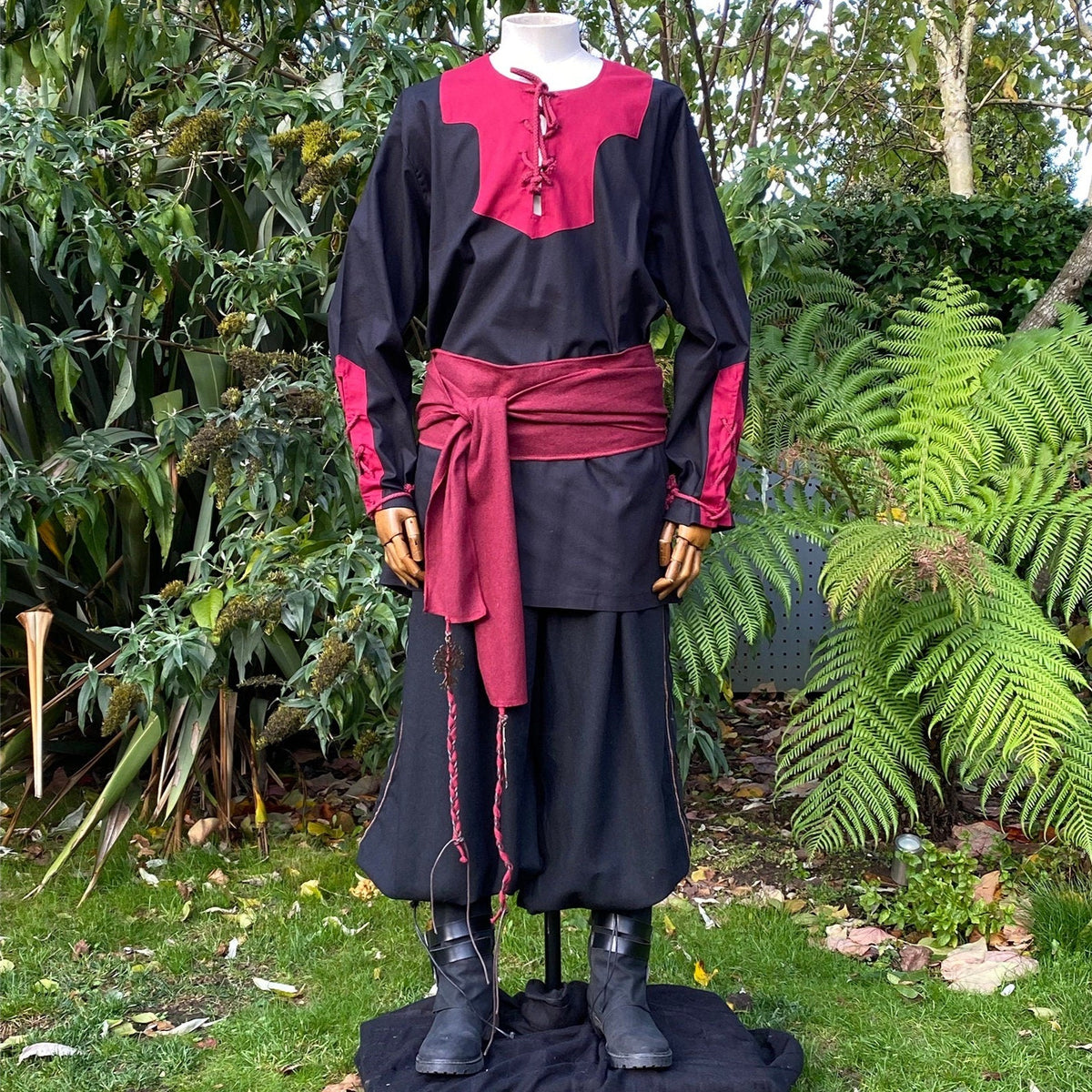 Mannequin in LARP medieval outfit with red sash, front.