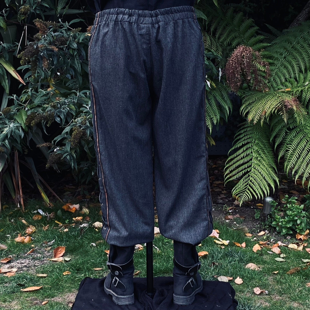 Back view of grey LARP pants showing side laces and.