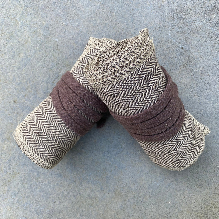 Set of Medieval LARPing Leg Wraps. They are Light Brown and made out of a Herringbone Wool mixture which are used to keep Trouser flares out of the way and legs warm. These Viking Wraps can wrap around your Legs to provide extra flare to LARP kit.