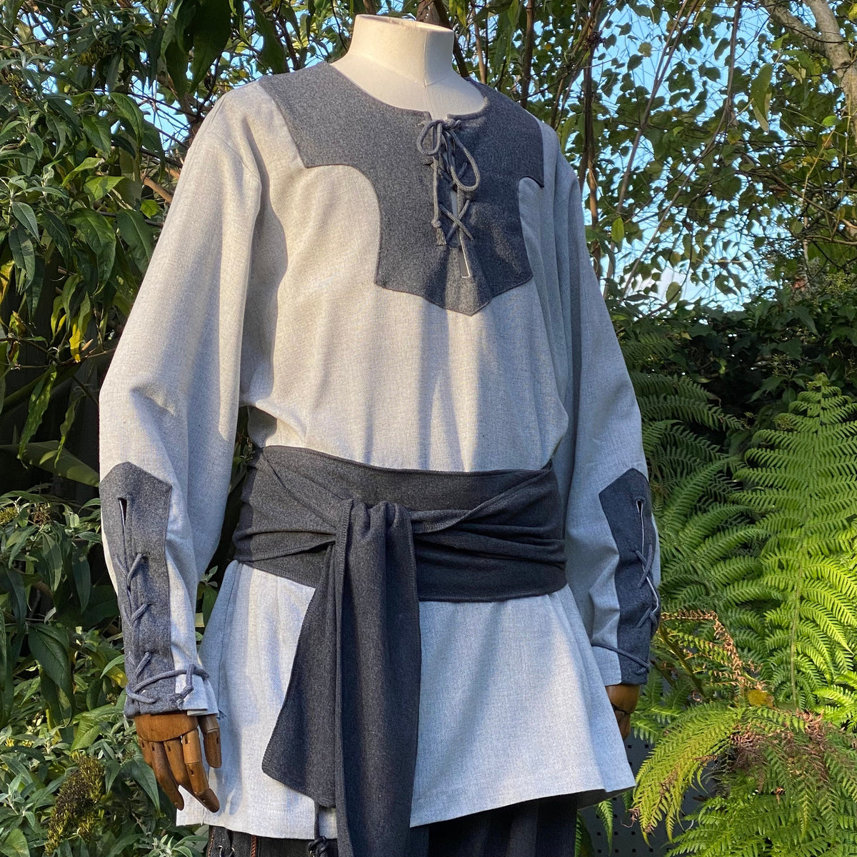 Medieval LARP tunic in two-tone grey with lace-up neckline and belt.