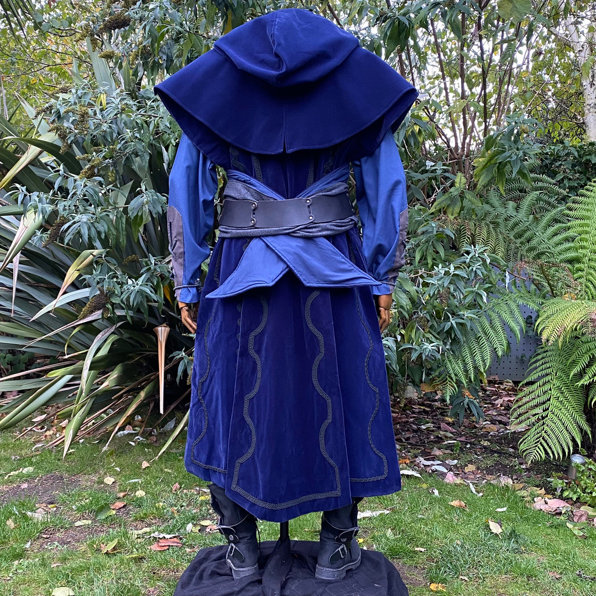 Back view of blue LARP cleric outfit with hood and detailed waist belt.