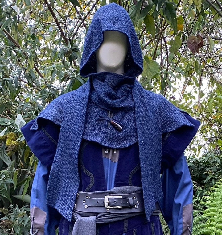 This LARP Hood is Blue with a Wrap Around Woollen extention. This Viking Scarf Hood is Water Resistant and Warm. You can style the Extended arms of the LARP Hood to fit your needs: perfect for your LARP Character and LARP Costume, Cosplay Event, and Ren Faire.