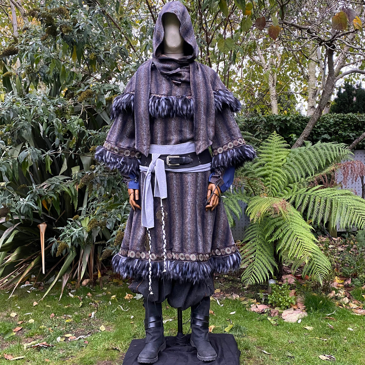 Arcane Warrior LARP outfit with hood, tunic, trousers, and sash in grey tones.