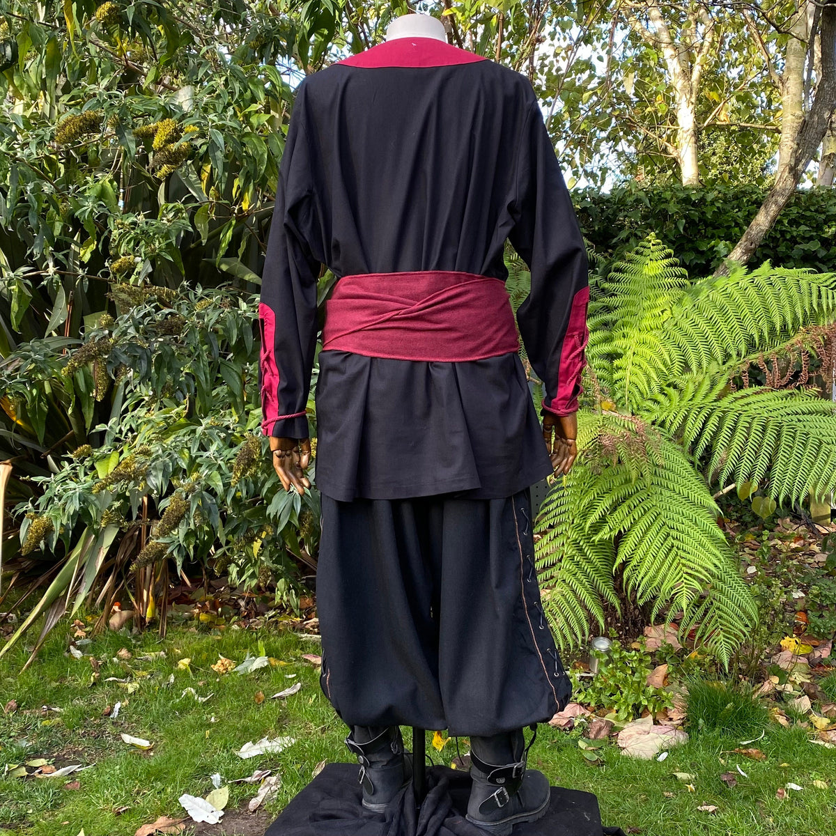 Back view of black-red medieval LARP outfit with sash.