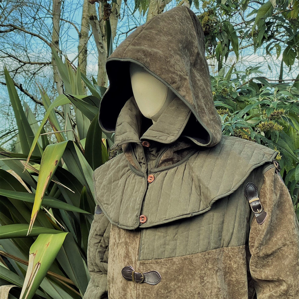 This Padded LARP Hood comes in Green Faux Suede. This Viking Hood has a Snood style, and is Water Resistant. The Gambeson Mantle of the Medieval Hood keeps you warm and dry. Perfect for your LARP Character and LARP Costume, Cosplay Event, and Ren Faire.