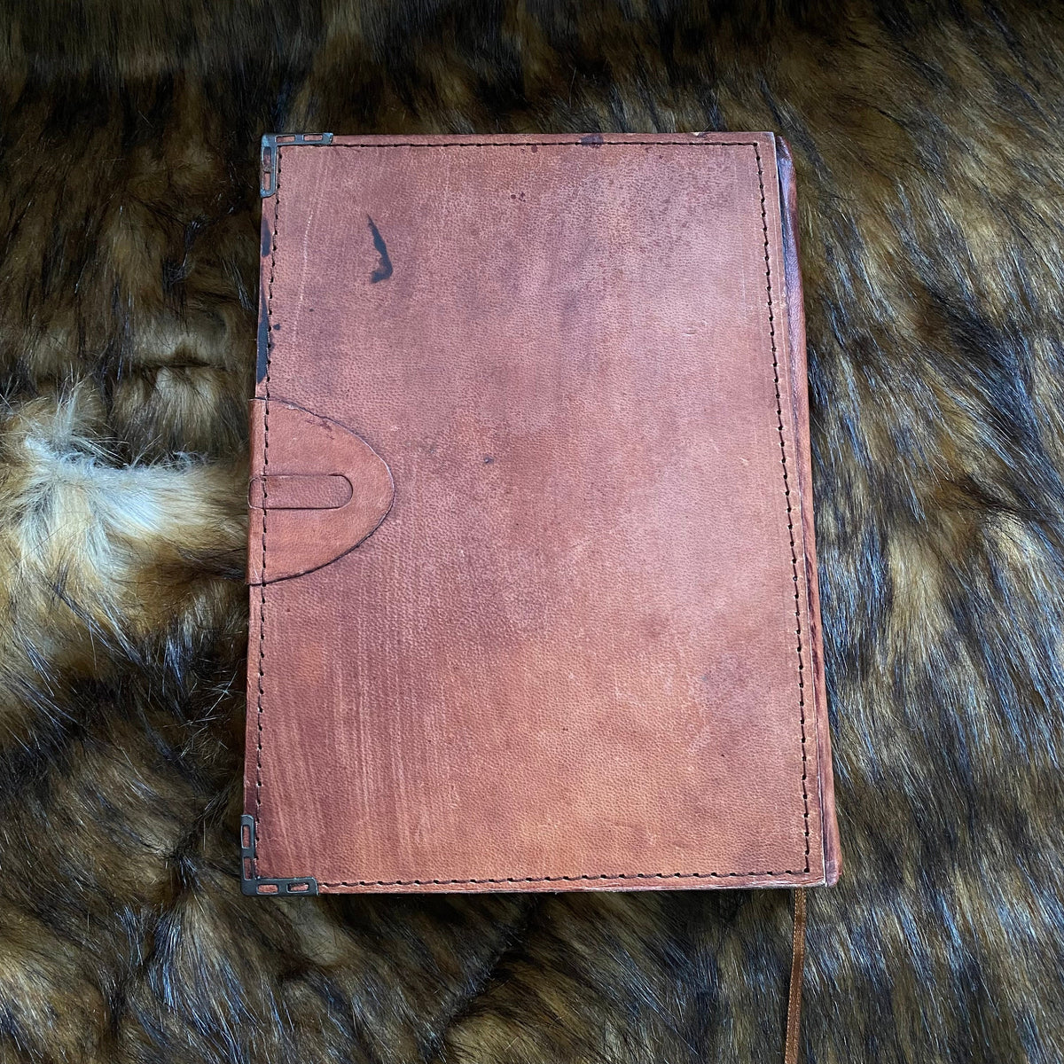 Rustic leather journal back on fur for LARP.
