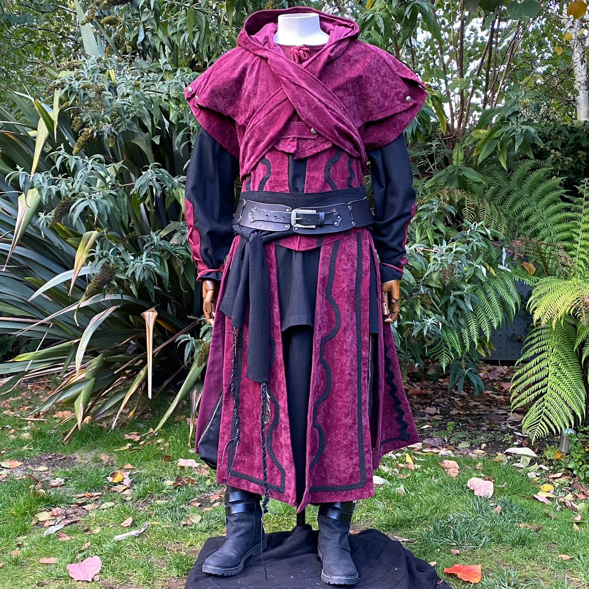Medieval LARP costume, burgundy tunic, black belt, and sash.