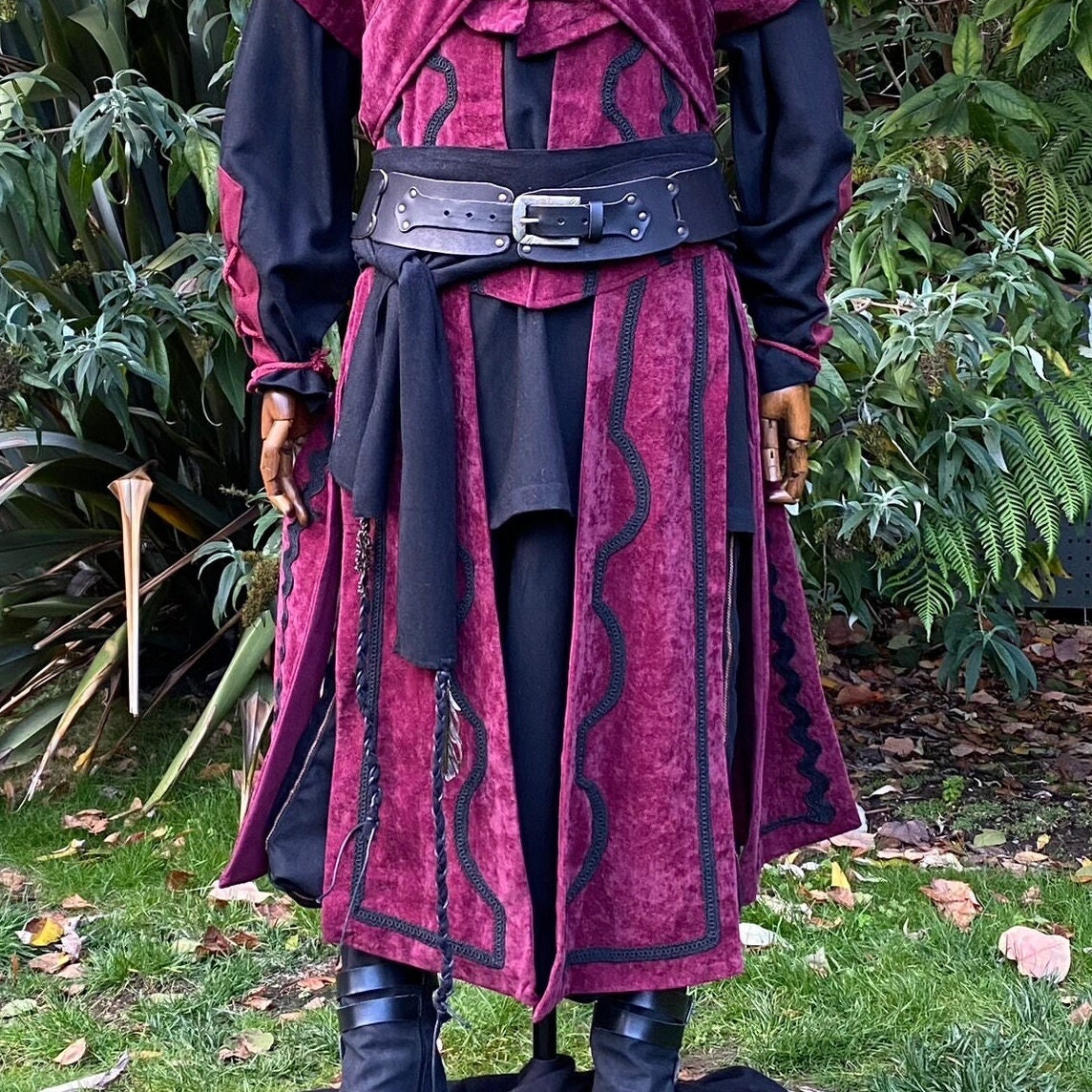 Medieval LARP black belt with sash over burgundy robe.