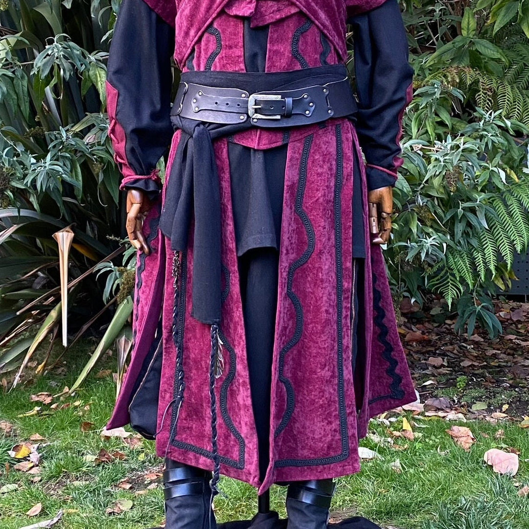 A LARP Belt and Costume Sash Set. The LARP Belt is made from Buffalo Leather in Black. The Viking Sash is a Black Wool sash that works well by itself, or underneath the LARP Belt. The Medieval Sash has a decorated metal accessories that adds to your LARP Character, Cosplay, or Ren Faire event.