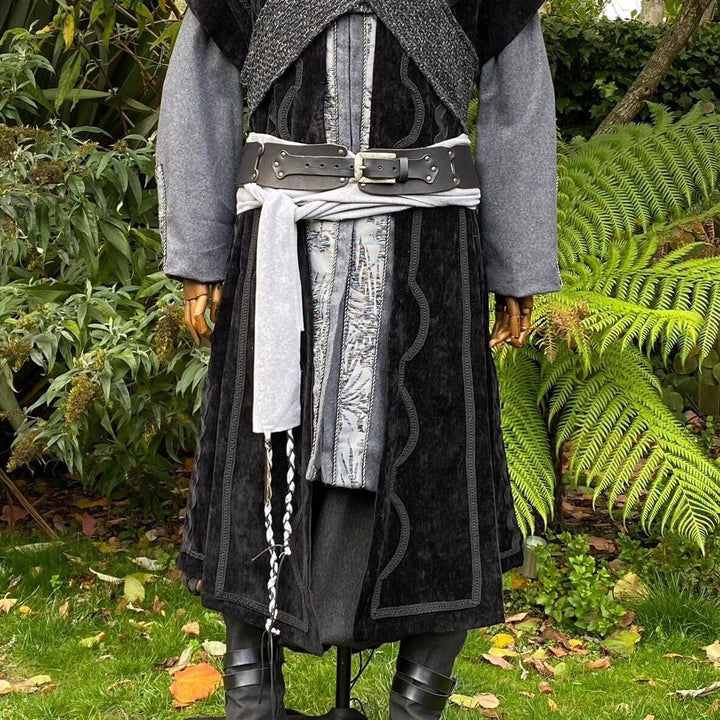 A LARP Belt and Costume Sash Set. The LARP Belt is made from Buffalo Leather in Black. The Viking Sash is a Light Grey Wool sash that works well by itself, or underneath the LARP Belt. The Medieval Sash has a decorated metal accessories that adds to your LARP Character, Cosplay, or Ren Faire event.