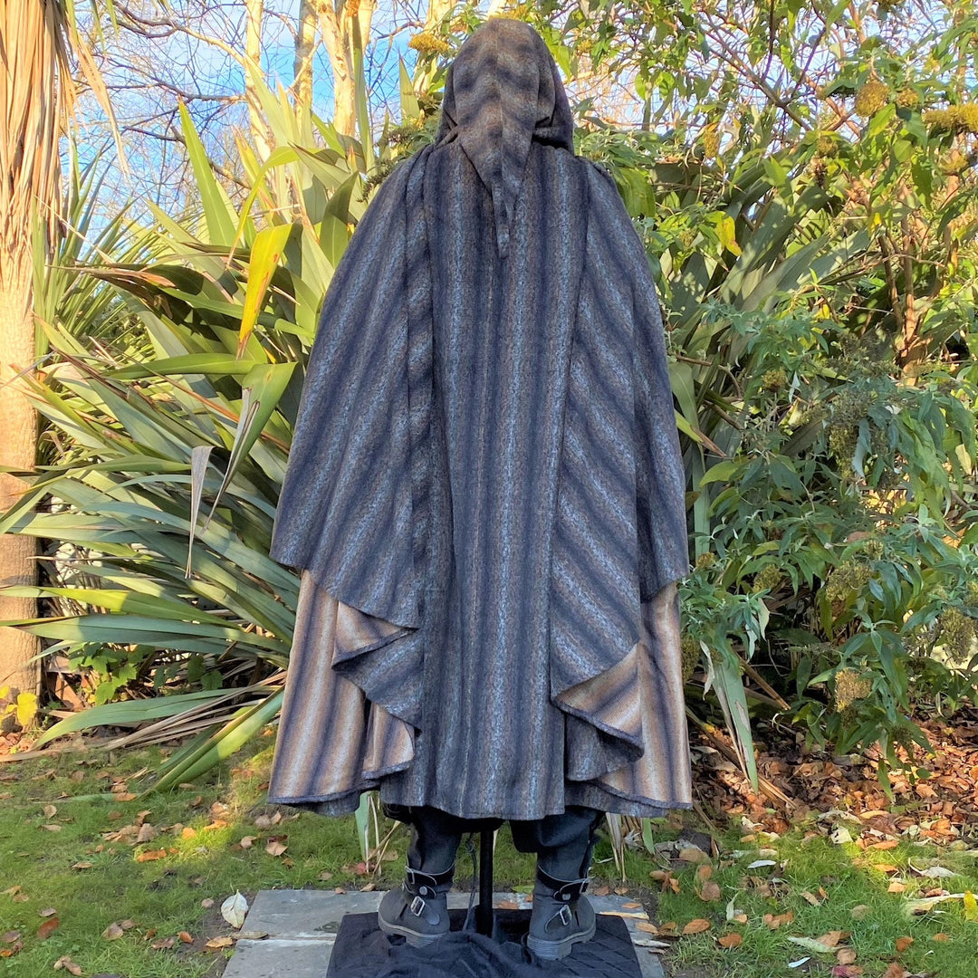 The Four Way LARP Cloak in Brown & Black Striped Mohair Wool is a Versatile Cape with Hood. The Medieval Cloak is Water Resistant, and helps keep you warm in the cold. The Viking Style Cloak can be worn in four ways for different character needs; perfect for your LARP character, Cosplay Events, and Ren Faires. 
