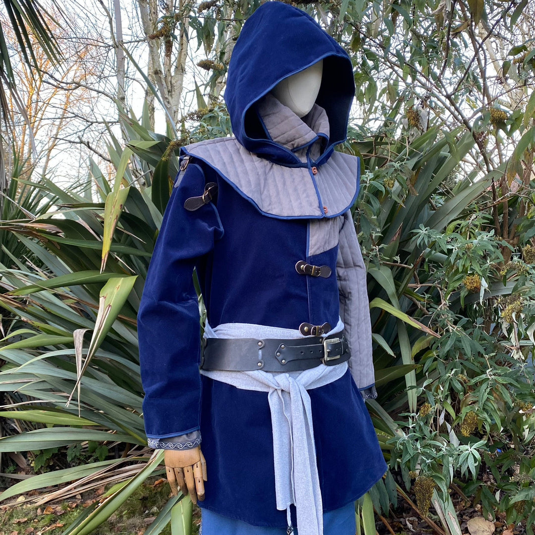 This Padded LARP Hood comes in Blue and Grey Faux Suede. This Viking Hood has a Snood style, and is Water Resistant. The Gambeson Mantle of the Medieval Hood keeps you warm and dry. Perfect for your LARP Character and LARP Costume, Cosplay Event, and Ren Faire.