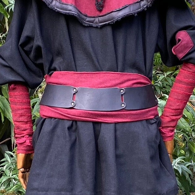 Medieval LARP back view, red-black belt and sash.