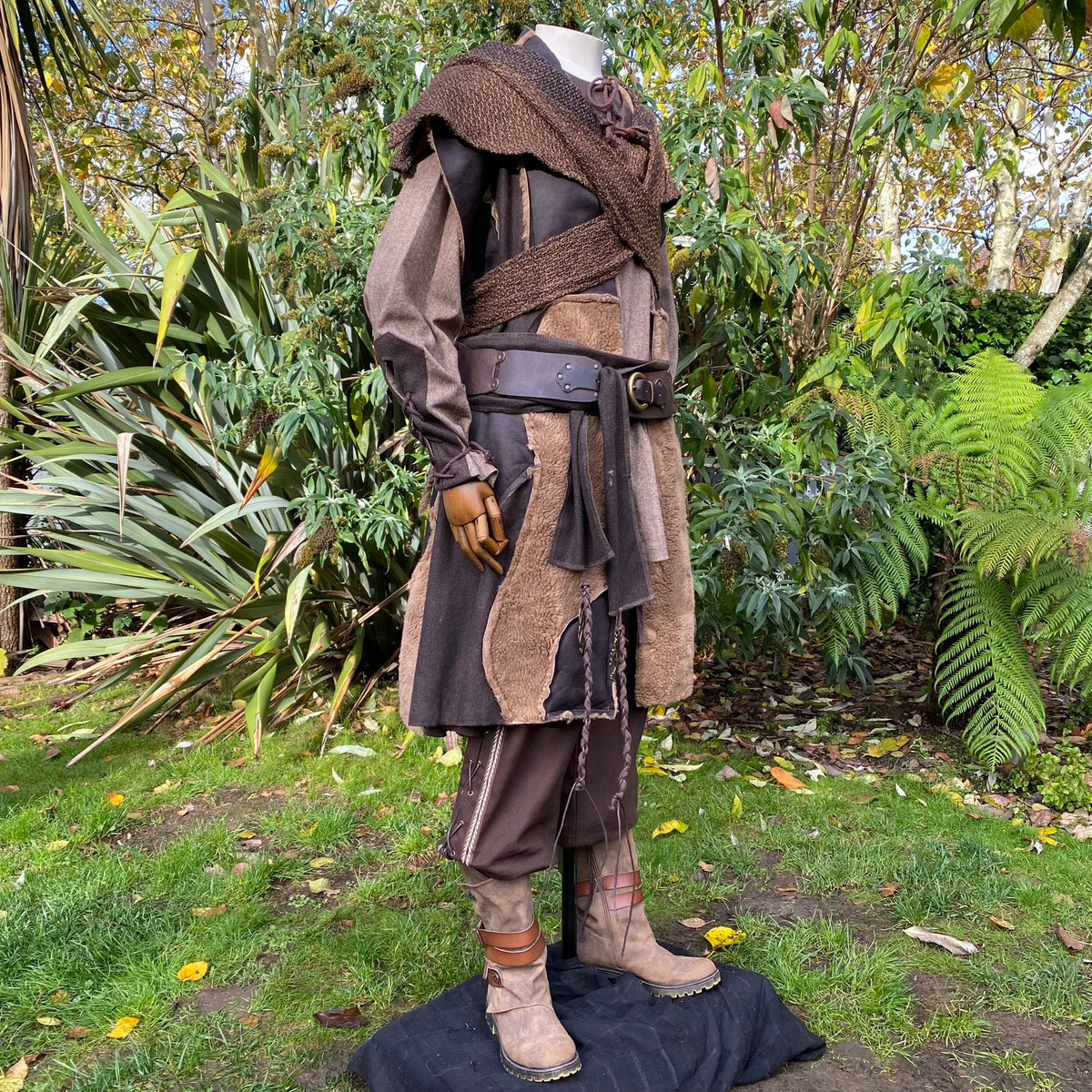 Mannequin in LARP outfit with brown belt, textured sash, and boots.