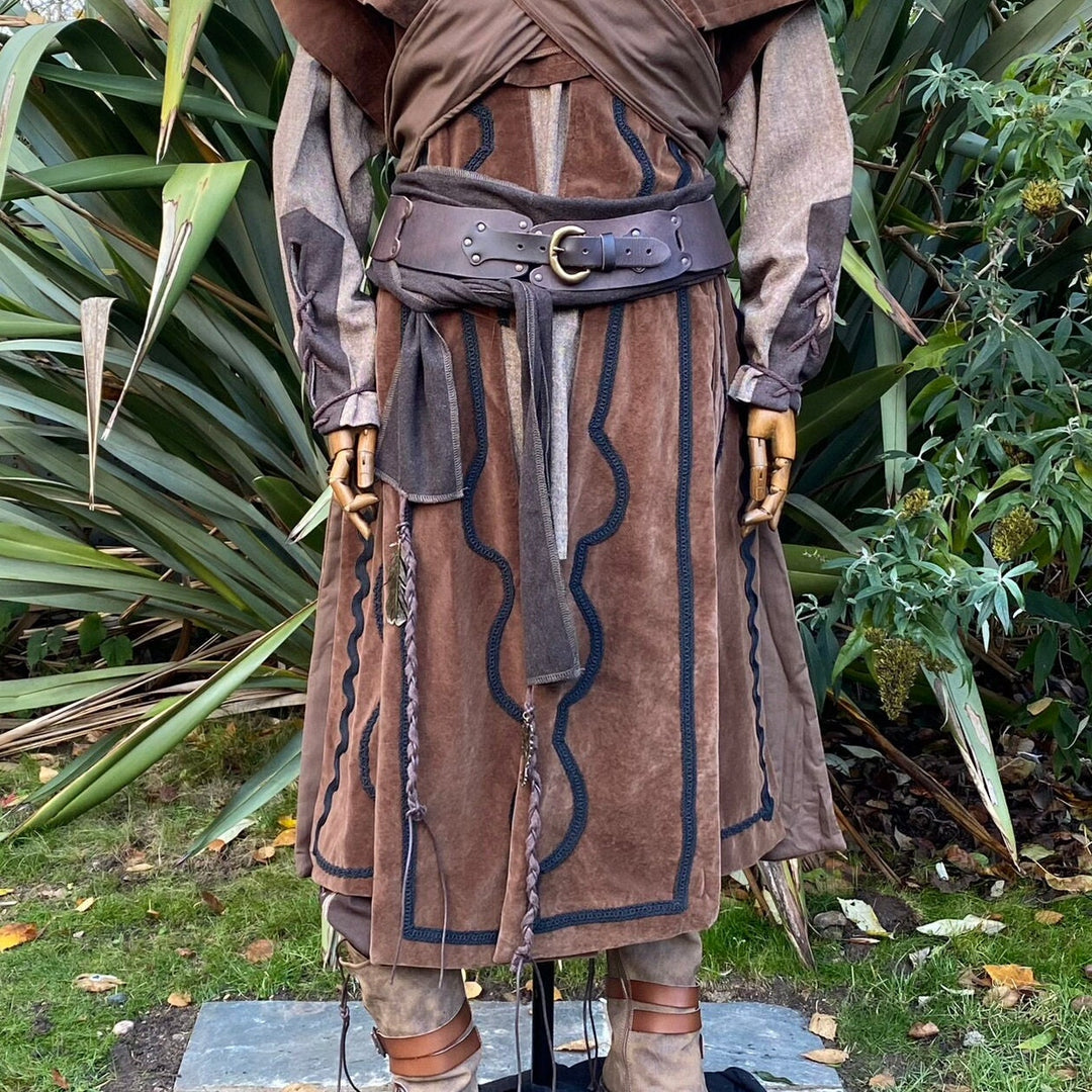 A LARP Belt and Costume Sash Set. The LARP Belt is made from Buffalo Leather in Brown. The Viking Sash is a Brown Wool sash that works well by itself, or underneath the LARP Belt. The Medieval Sash has a decorated metal accessories that adds to your LARP Character, Cosplay, or Ren Faire event.