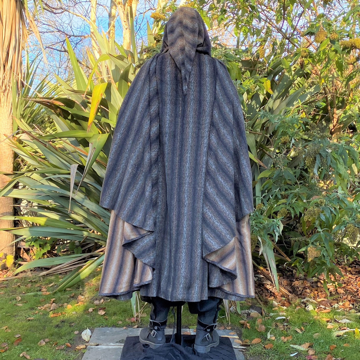 Back view of hooded blue and grey striped LARP cloak, full-length medieval fantasy cosplay.