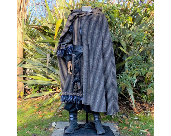 The Four Way LARP Cloak in Blue & Grey Mohair Wool is a Versatile Cape with Hood. The Medieval Cloak is Water Resistant, and helps keep you warm in the cold. The Viking Style Cloak can be worn in four ways for different character needs; perfect for your LARP character, Cosplay Events, and Ren Faires. 