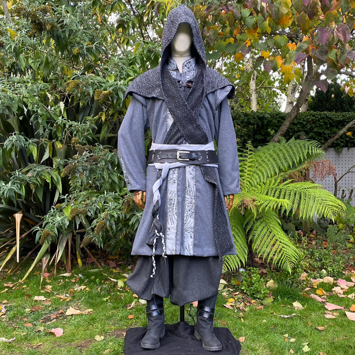 Medieval LARP outfit with hood up, front garden view, grey tones.