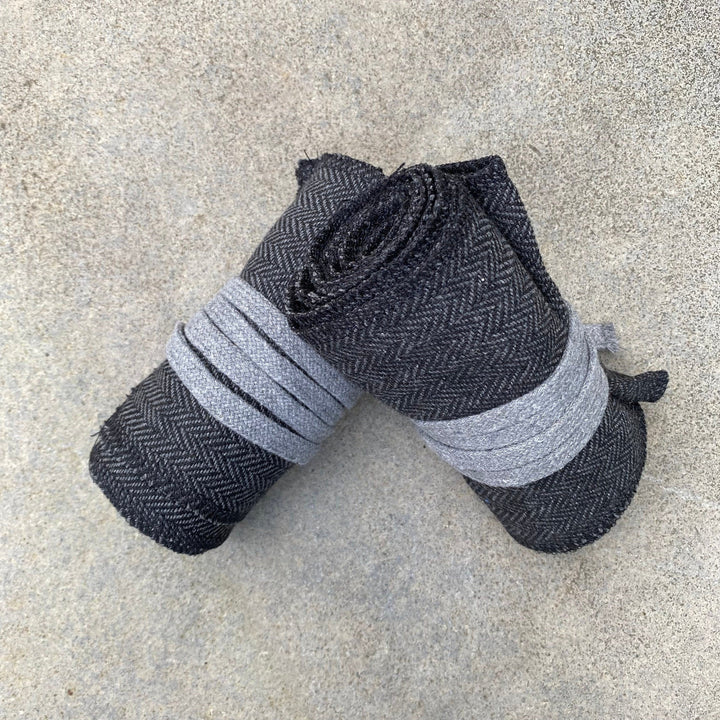 Set of Medieval LARPing Leg Wraps. They are Dark Grey and made out of a Herringbone Wool mixture which are used to keep Trouser flares out of the way and legs warm. These Viking Wraps can wrap around your Legs to provide an extra flare to LARP kit.