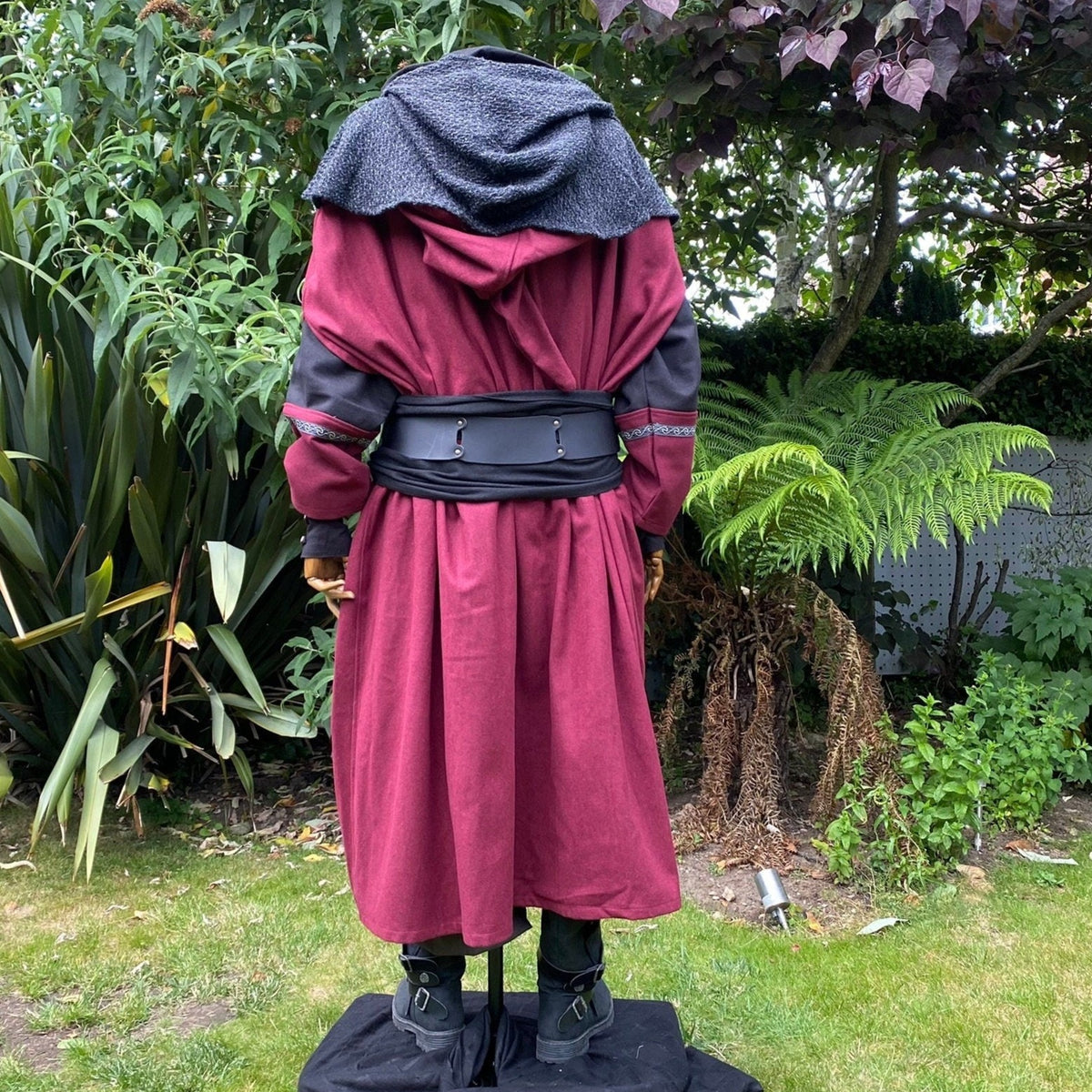 Back view of LARP outfit; red cloak, hood down, black belt.