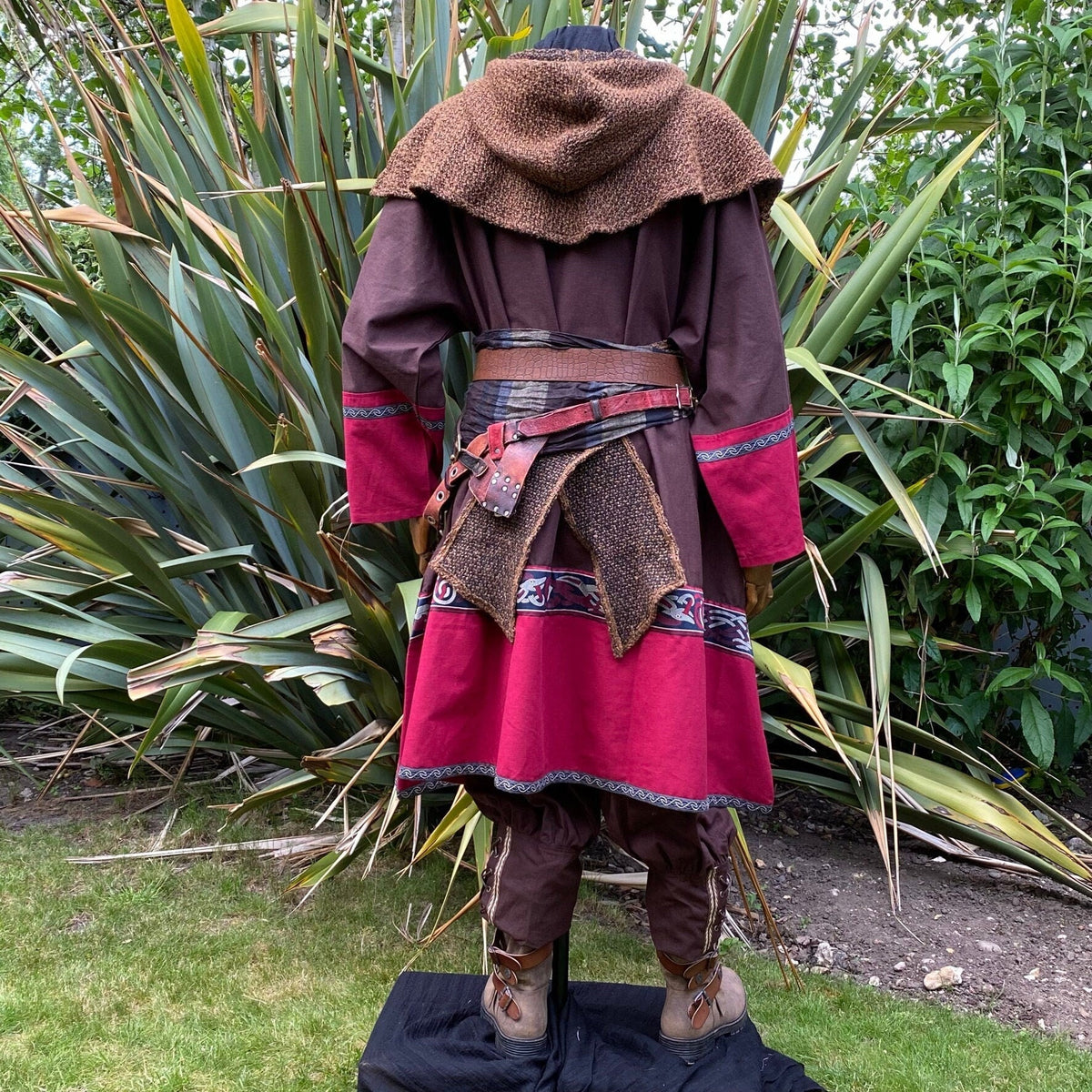 Medieval LARP outfit back view, featuring a brown and red Viking tunic, wrap around hood and.
