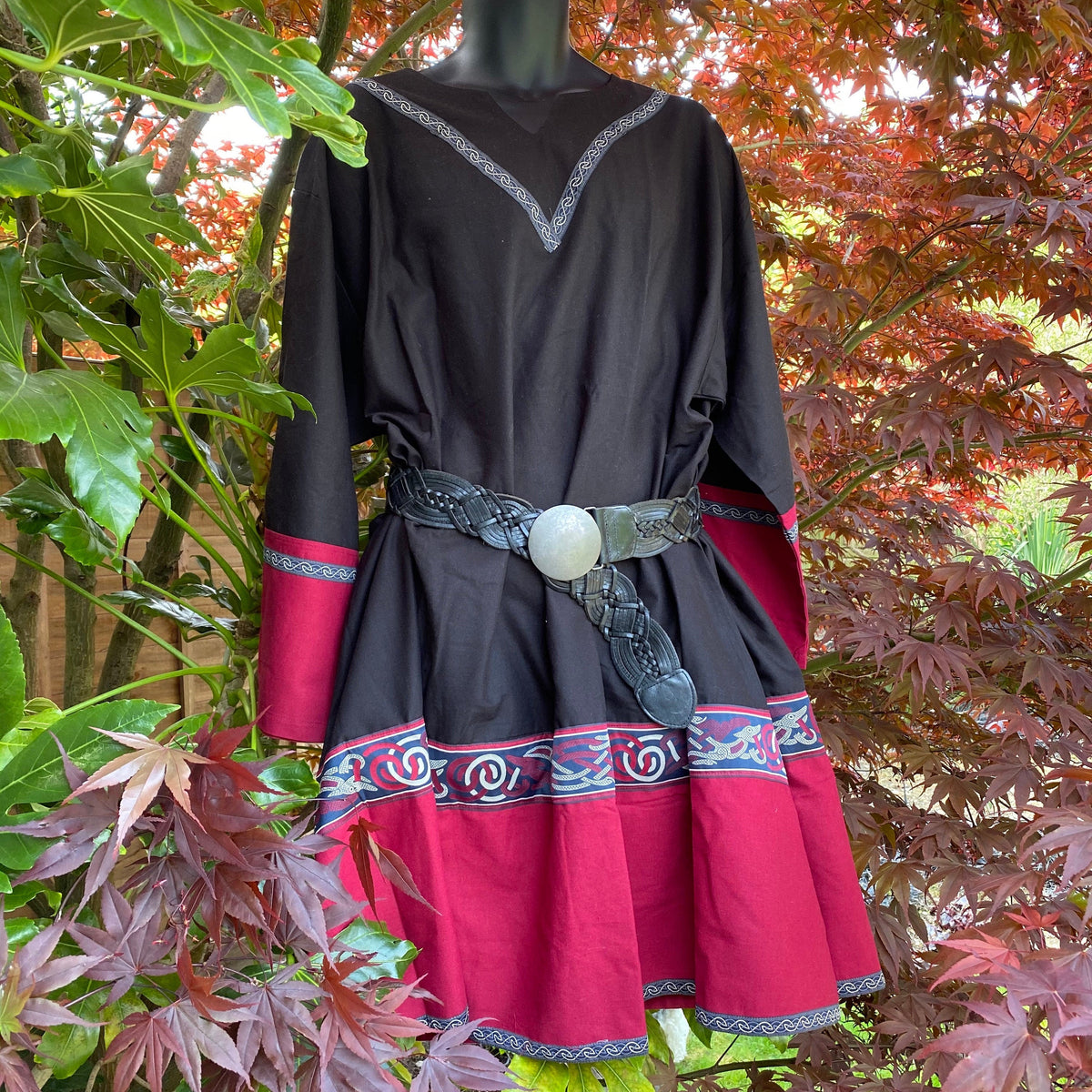 Black and red LARP tunic with intricate trim, styled with a leather belt.