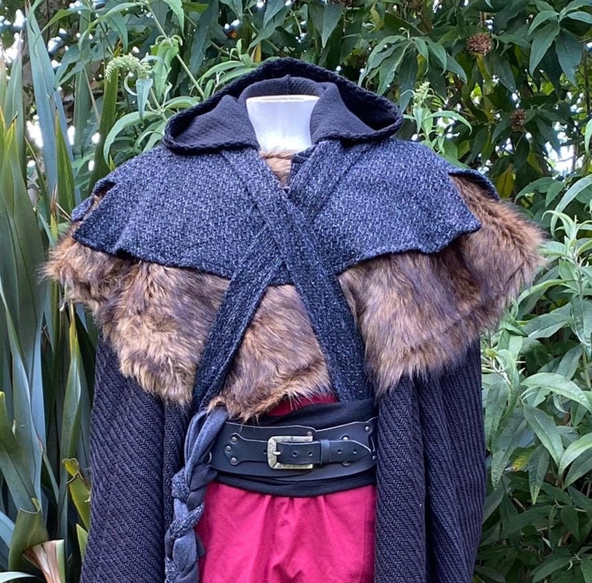 Medieval LARP outfit with faux fur mantle and cross-wrap hood, side view.