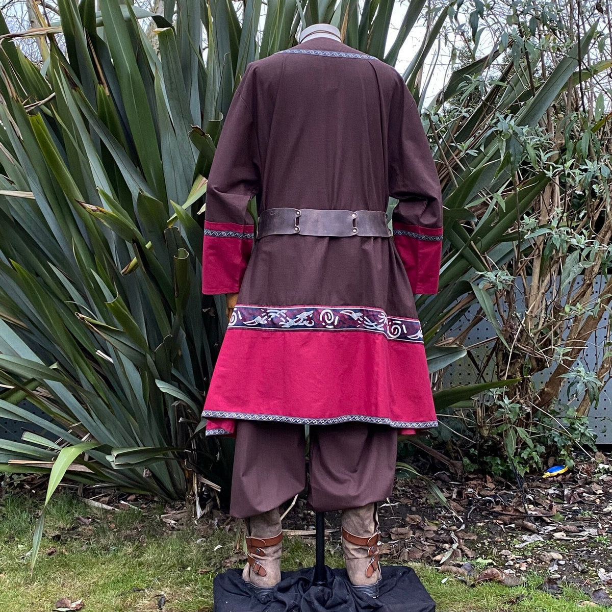 Back view of medieval LARP tunic in brown, red with belt and embroidery.