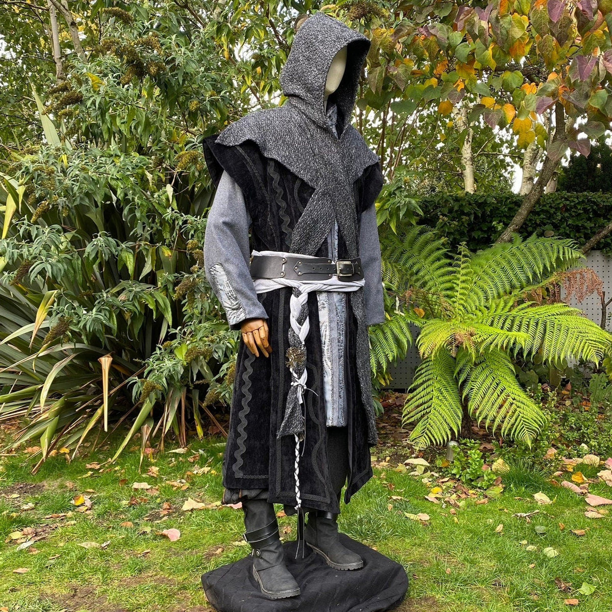 Mannequin in medieval LARP outfit with hooded jacket in a.
