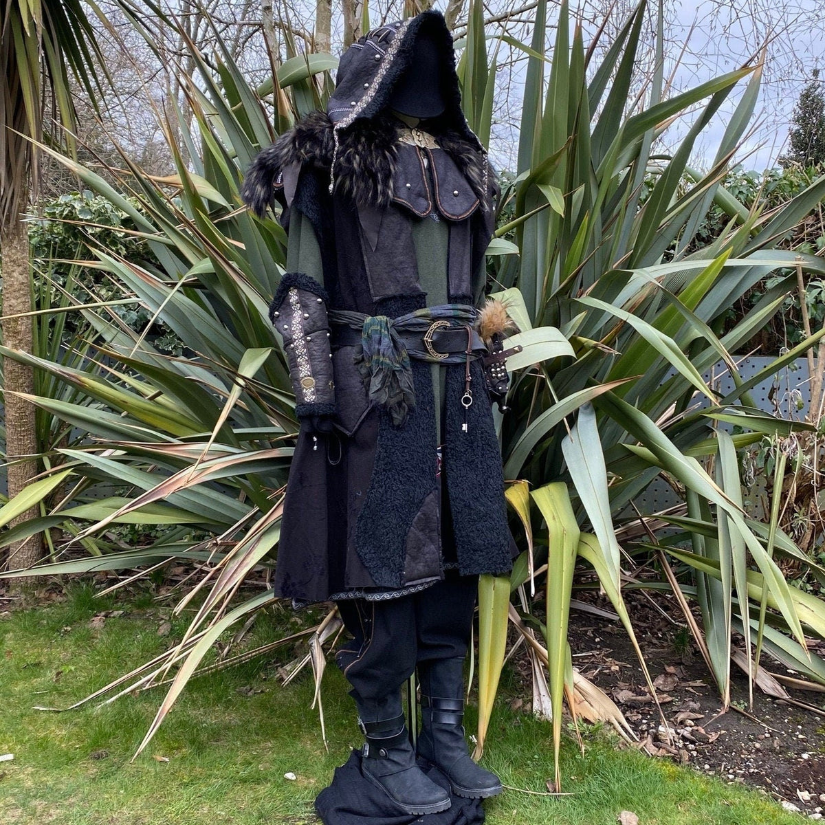 Medieval LARP outfit with fur collar, hooded cloak, and detailed vambraces.