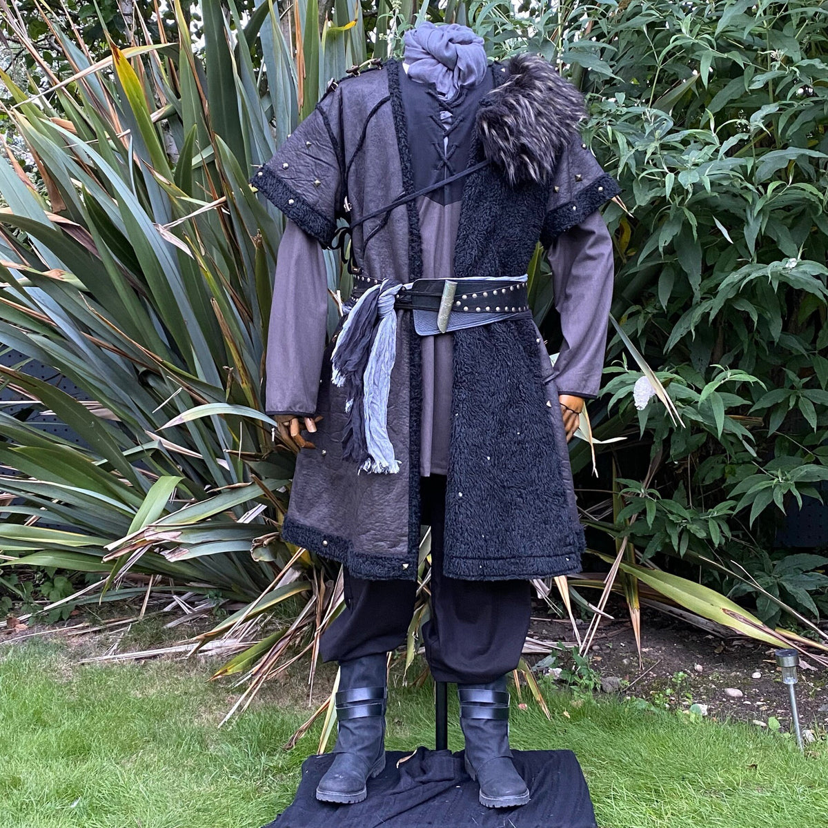 Medieval LARP tunic front view with faux fur trim and studded details.