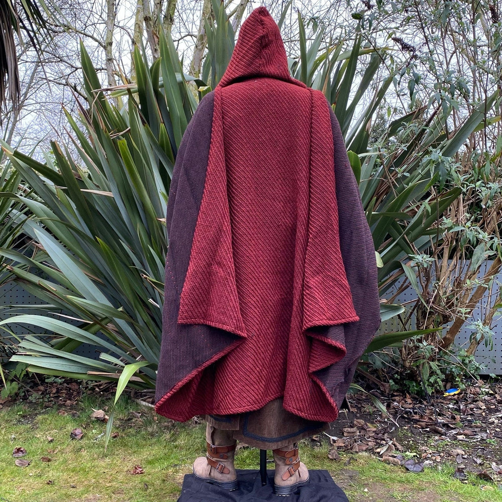The Four Way LARP Cloak in Red Herringbone Wool with Reversable Black Faux Fur & Leather Brown Mantle is a Versatile Cape with Hood. The Medieval Cloak is Water Resistant and helps keep you warm. The Viking Style Cloak can be worn in four ways; perfect for your LARP character, Cosplay Events, and Ren Faires. 