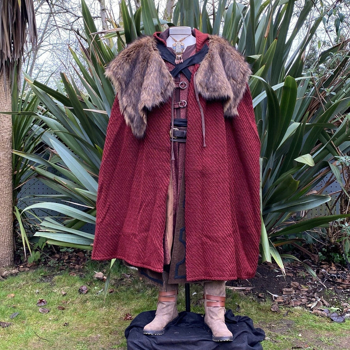 The Four Way LARP Cloak in Red Herringbone Wool with Reversable Brown Faux Fur & Leather Brown Mantle is a Versatile Cape with Hood. The Medieval Cloak is Water Resistant and helps keep you warm. The Viking Style Cloak can be worn in four ways; perfect for your LARP character, Cosplay Events, and Ren Faires. 