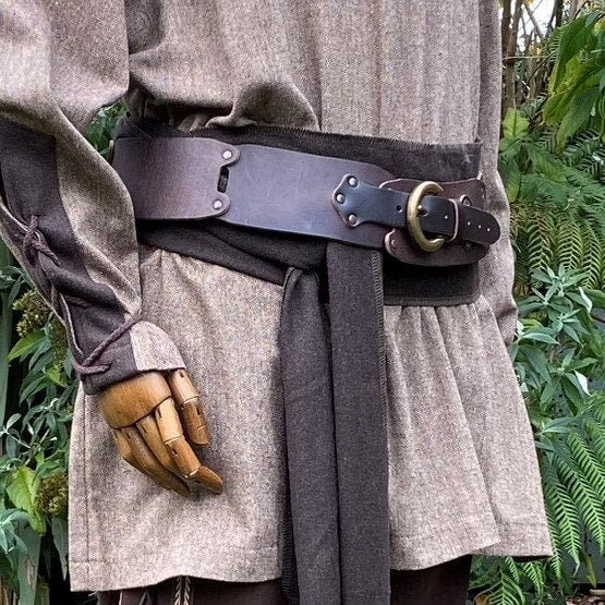 Brown leather LARP belt on medieval tunic with brass buckle detail.