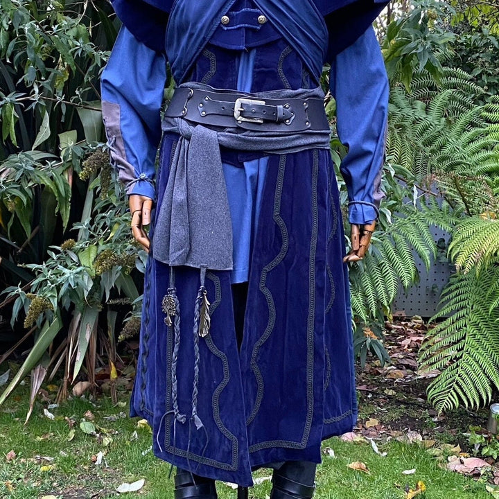 A LARP Belt and Costume Sash Set. The LARP Belt is made from Buffalo Leather in Black. The Viking Sash is a Dark Grey Wool sash that works well by itself, or underneath the LARP Belt. The Medieval Sash has a decorated metal accessories that adds to your LARP Character, Cosplay, or Ren Faire event.