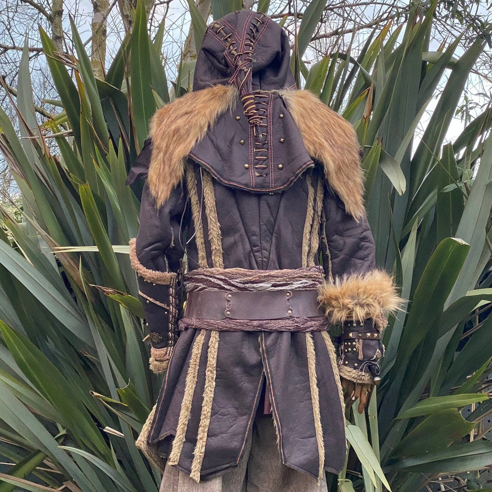 Medieval LARP costume back view featuring a brown faux leather jacket, hood and vambraces. For Renaissance Faire and historical roleplay events.