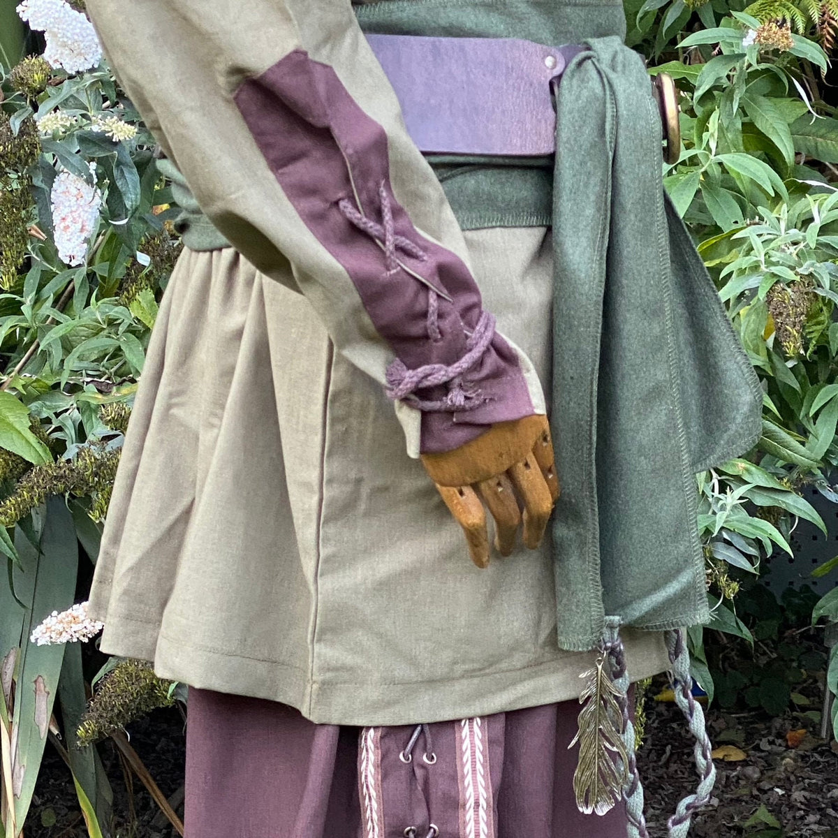 Medieval LARP outfit, side view of shirt with brown laced sleeve detail.