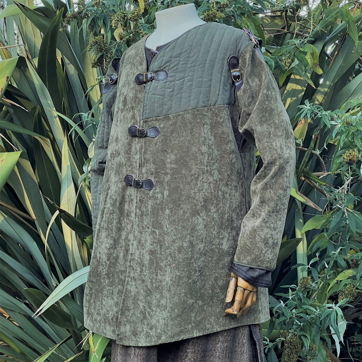 This LARP Gambeson Jacket comes in Green Faux Suede. The LARP Armor has Removeable Sleeves that attach at the shoulder. The Padded Armor is warm and water resistant. This Jacket is perfect for your LARP Costume and LARP Character, Cosplay Events, and Ren Faires.