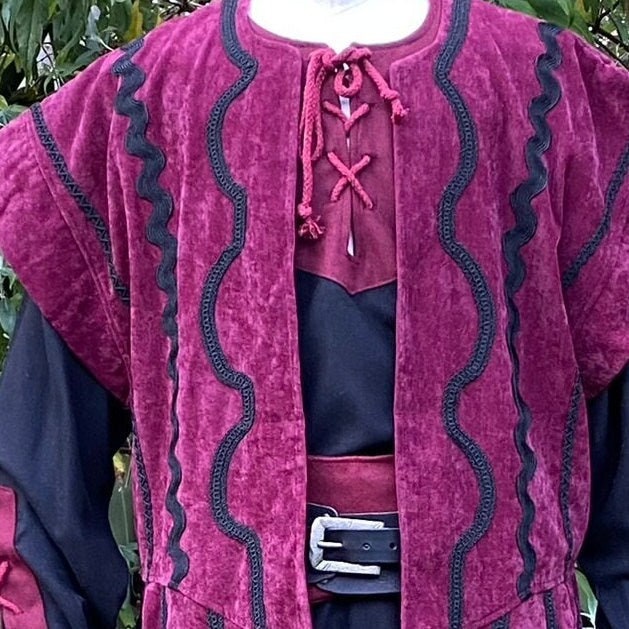 Red medieval waistcoat with black wavy trim for LARP.