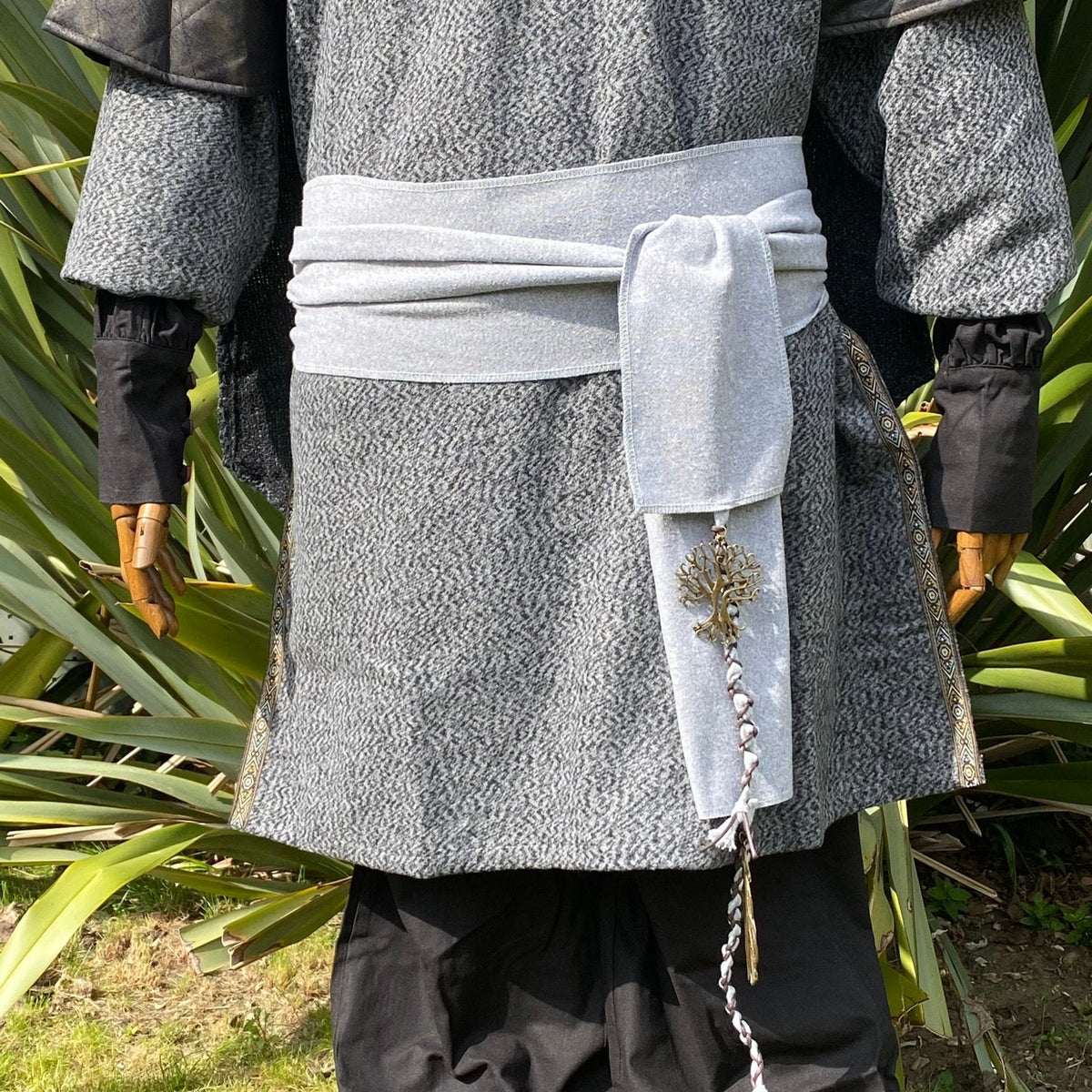 Light grey wool sash with tree pendant, styled on medieval costume.