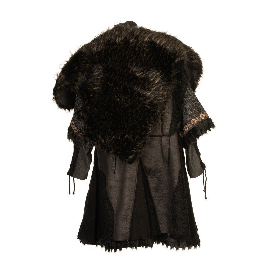 This LARP Fur Mantle is made from Faux Black & Brown Fur and is reversable. On the other side there is Black Faux Leather. The LARP Accessory is water resistant and has Woollen straps that can tie it to oneself. Perfect for LARP Characters & Cosplay.