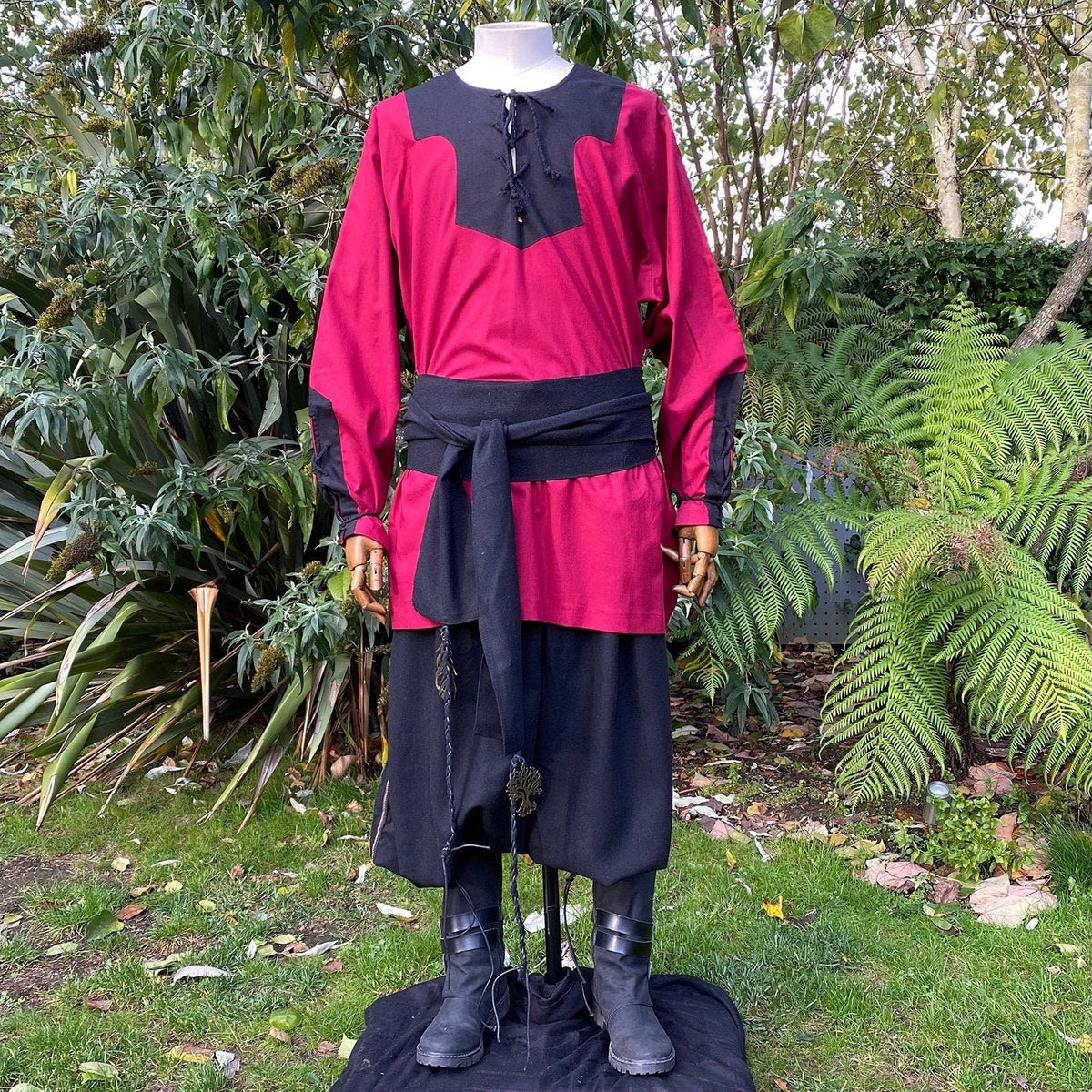 LARP outfit displayed outdoors: red tunic, black pants, and sash styling.