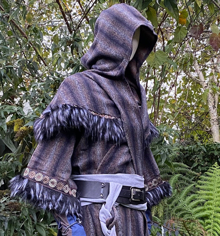 This LARP Hood in Blue & Grey Moahir Wool has Faux Fur Trimming in Black & Grey with Braiding. This Viking Hood is Water Resistant towards rain. The Medieval Hood covers your shoulders and provides warmth. Perfect for your LARP Character and LARP Costume, Cosplay Event, and Ren Faire.