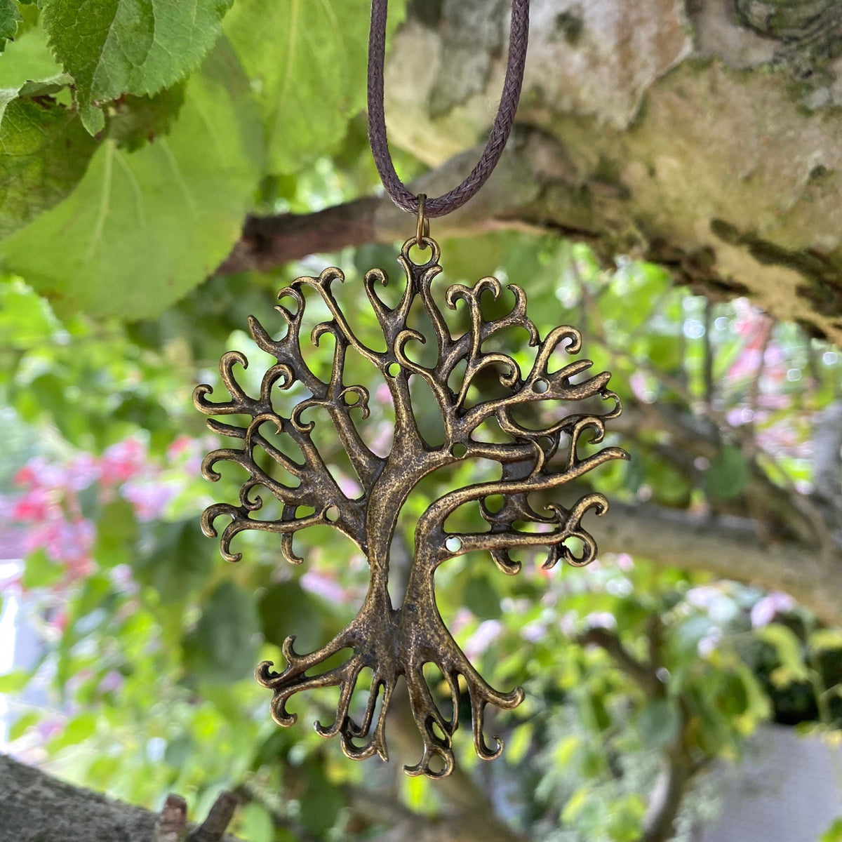 Antique brass tree pendant in nature for LARP.