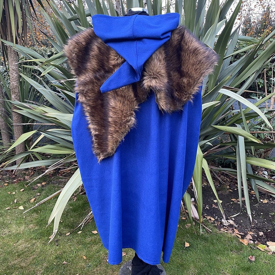 Back view of blue LARP cloak with hood, faux fur mantle.