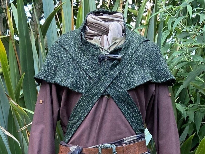 This LARP Hood is Green with a Wrap Around Woollen extention. This Viking Scarf Hood is Water Resistant and Warm. You can style the Extended arms of the LARP Hood to fit your needs: perfect for your LARP Character and LARP Costume, Cosplay Event, and Ren Faire.