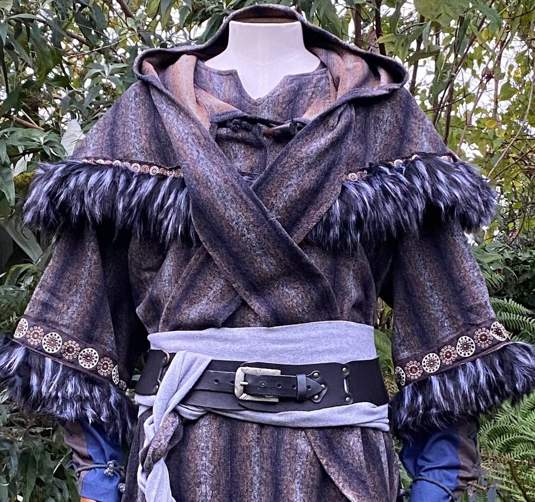This LARP Hood in Blue & Grey Moahir Wool has Faux Fur Trimming in Black & Grey with Braiding. This Viking Hood is Water Resistant towards rain. The Medieval Hood covers your shoulders and provides warmth. Perfect for your LARP Character and LARP Costume, Cosplay Event, and Ren Faire.